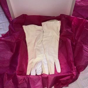 White leather gloves.